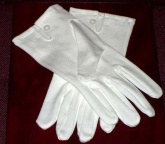 White cotton gloves, good grade make, mother of pearl button and tri stitched back.